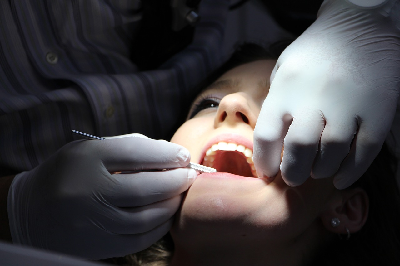 dentist checking patient